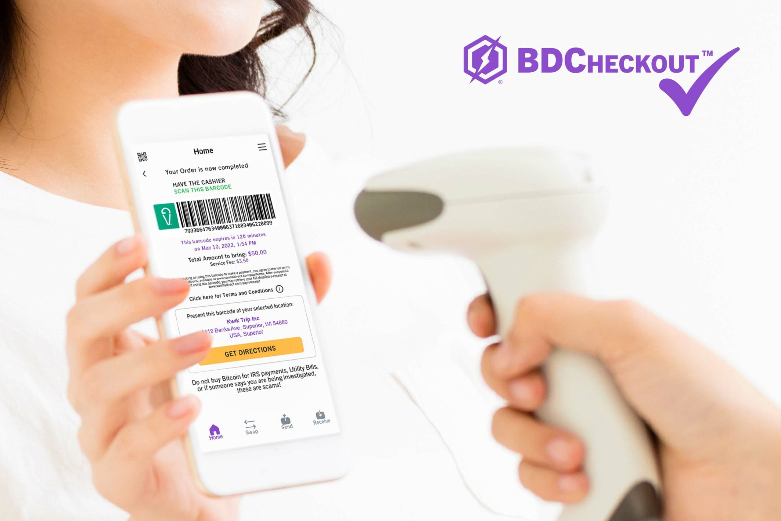 A close-up photo showing hands holding a smartphone displaying a BDCheckout™ payment screen with a barcode.